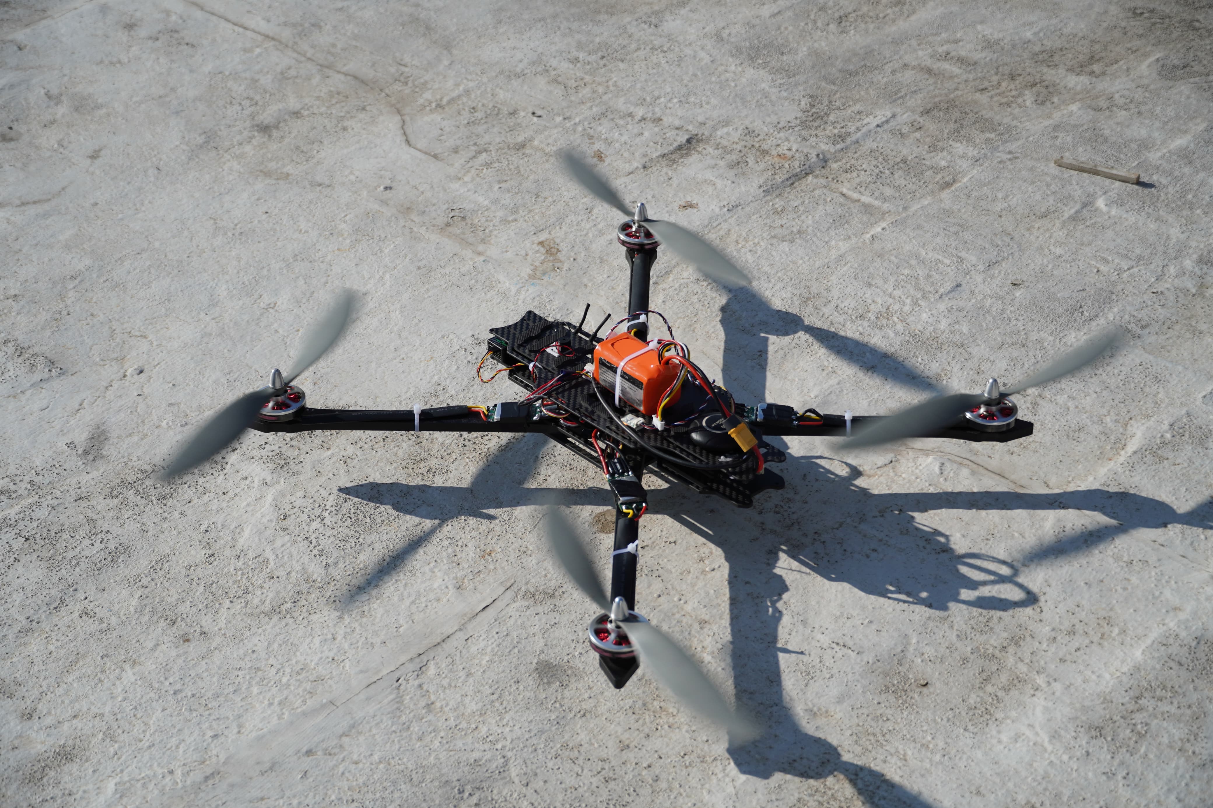 QGP-1 flight test photograph on a concrete launch surface